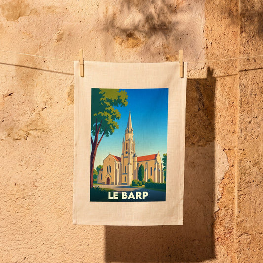 Torchon souvenir de la ville de Le Barp avec une illustration stylisée de son église.