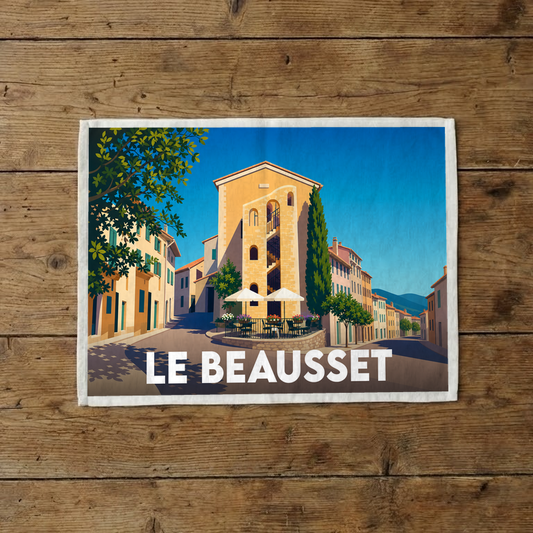 Torchon souvenir de la ville de Le Beausset avec une illustration stylisée d'une place ensoleillée.