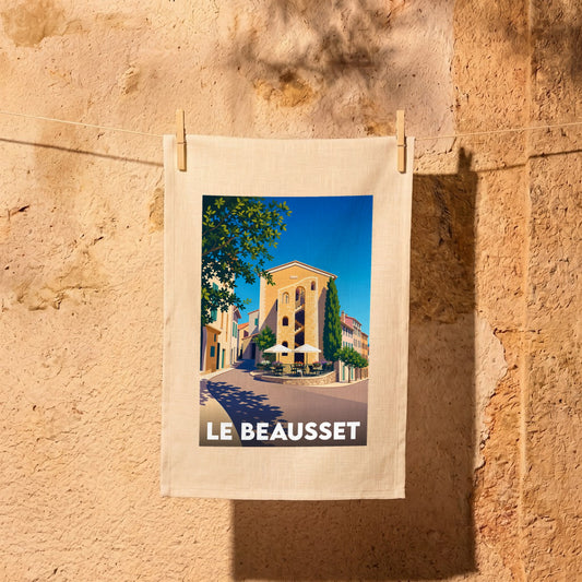 Torchon souvenir de la ville de Le Beausset avec une illustration stylisée d'une place ensoleillée.