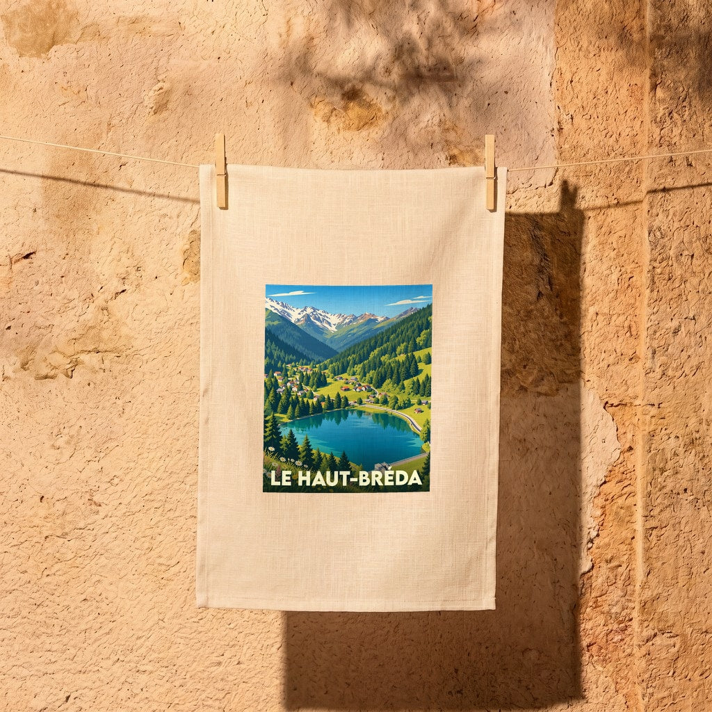 Torchon souvenir de la ville de Le Haut-Bréda avec une illustration stylisée de paysages de montagne.