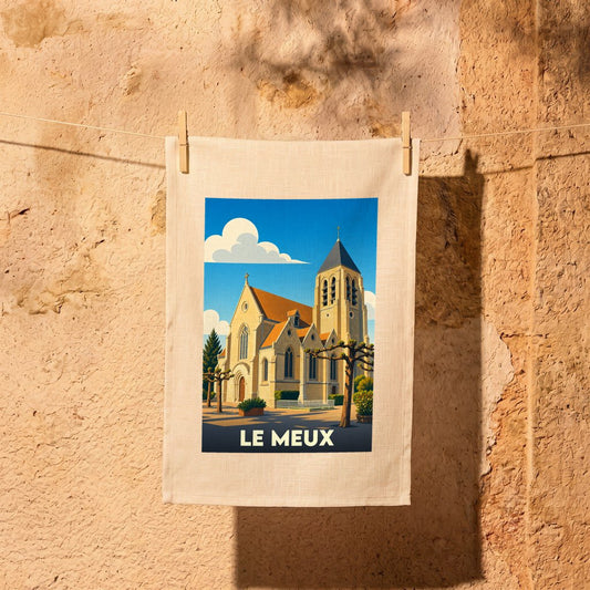 Torchon souvenir de la ville de Le Meux avec une illustration stylisée de son église.