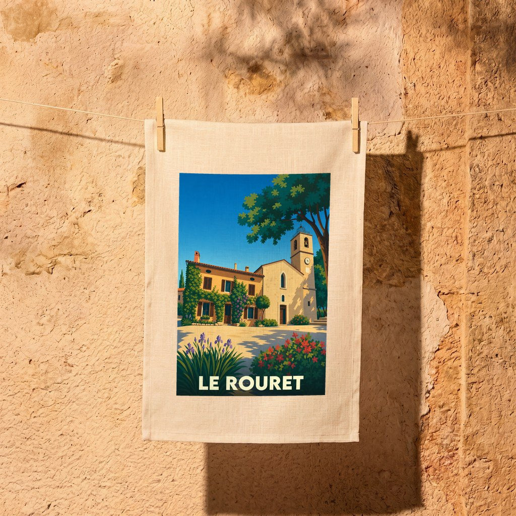 Torchon souvenir de la ville de Le Rouret avec une illustration stylisée d'une église provençale.