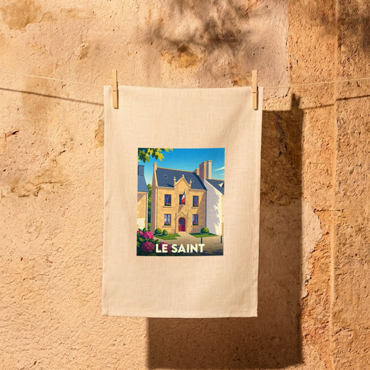 Torchon souvenir de la ville de Le Saint avec une illustration stylisée d'un bâtiment typique.