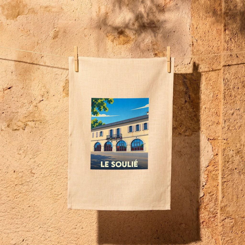 Torchon souvenir de la ville de Le Soulié avec une illustration stylisée d'un bâtiment emblématique.