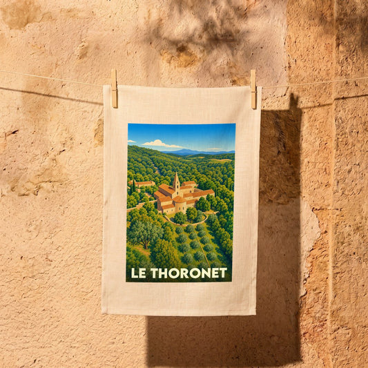 Torchon souvenir de la ville de Le Thoronet avec une illustration stylisée.