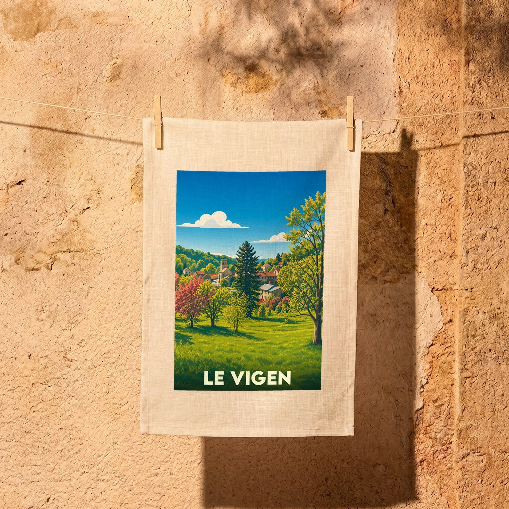 Torchon souvenir de la ville de Le Vigen illustrant un paysage de campagne ensoleillé.