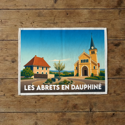 Torchon souvenir de la ville de Les Abrets en Dauphiné avec une illustration stylisée de son église et de son centre-bourg.