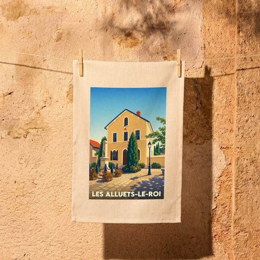Torchon souvenir de la ville de Les Alluets-le-Roi avec une illustration stylisée.