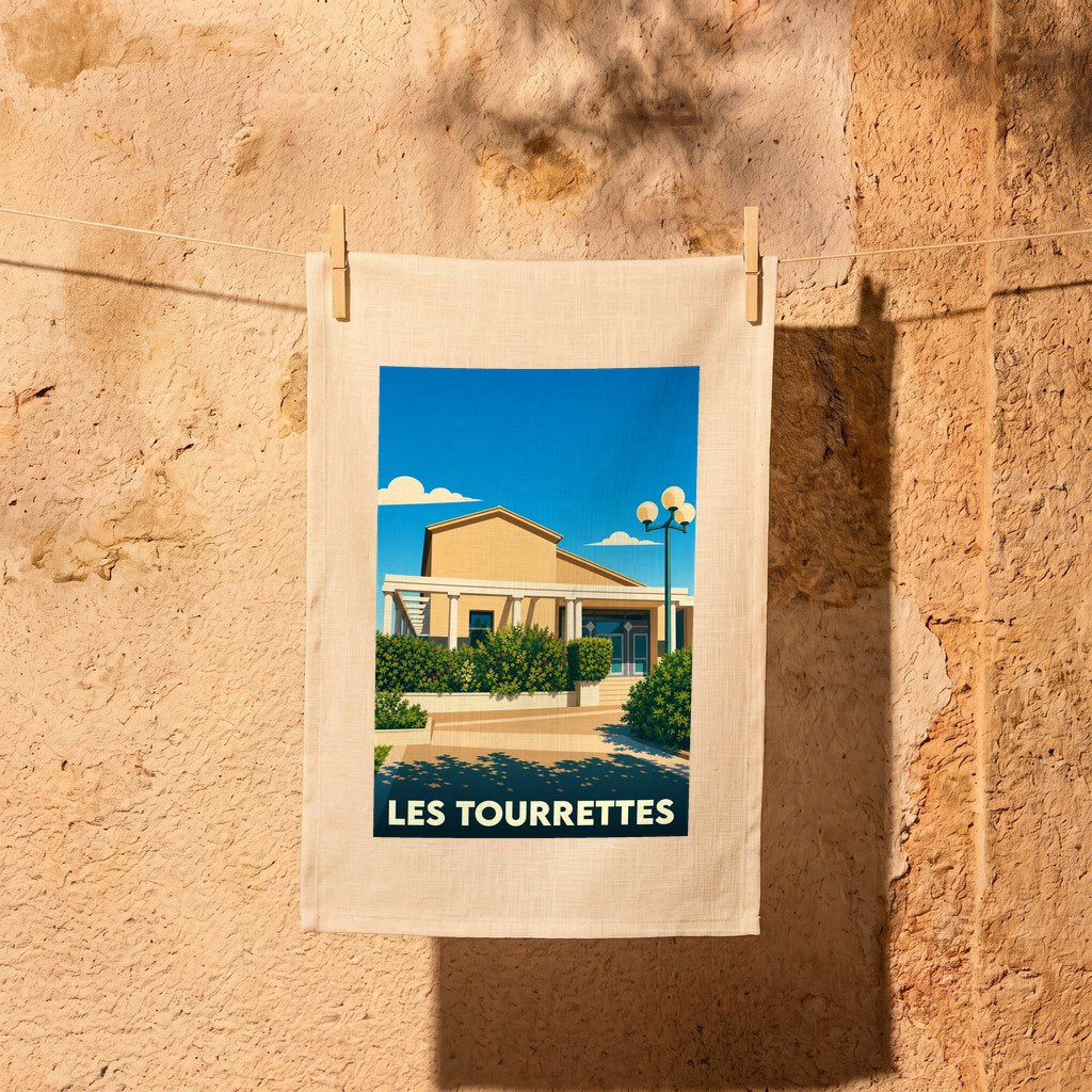 Torchon souvenir de la ville de Les Tourrettes avec une illustration stylisée.