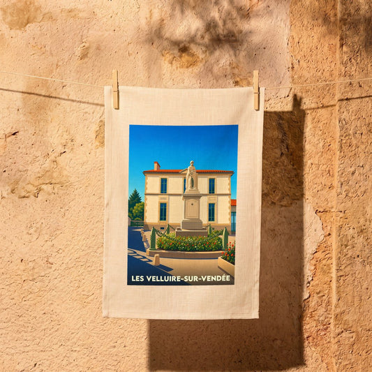 Torchon souvenir de la ville de Les Velluire-sur-Vendée avec une illustration stylisée.