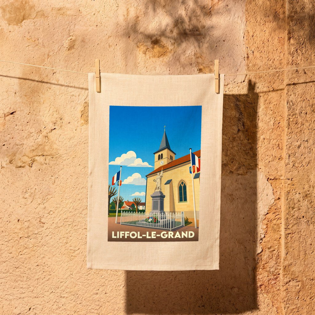 Torchon souvenir de la ville de Liffol-le-Grand illustré d'un dessin stylisé de son église et de son monument.