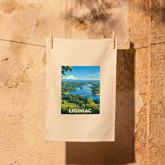 Torchon souvenir de la ville de Liginiac avec une illustration paysagère stylisée.