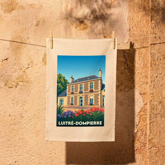 Torchon souvenir de la ville de Luitré-Dompierre avec une illustration stylisée d'une maison de maître.