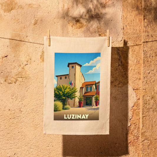 Torchon souvenir de la ville de Luzinay avec une illustration stylisée d'un bâtiment provençal.