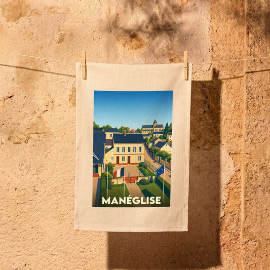 Torchon souvenir de la ville de Manéglise avec une illustration stylisée.