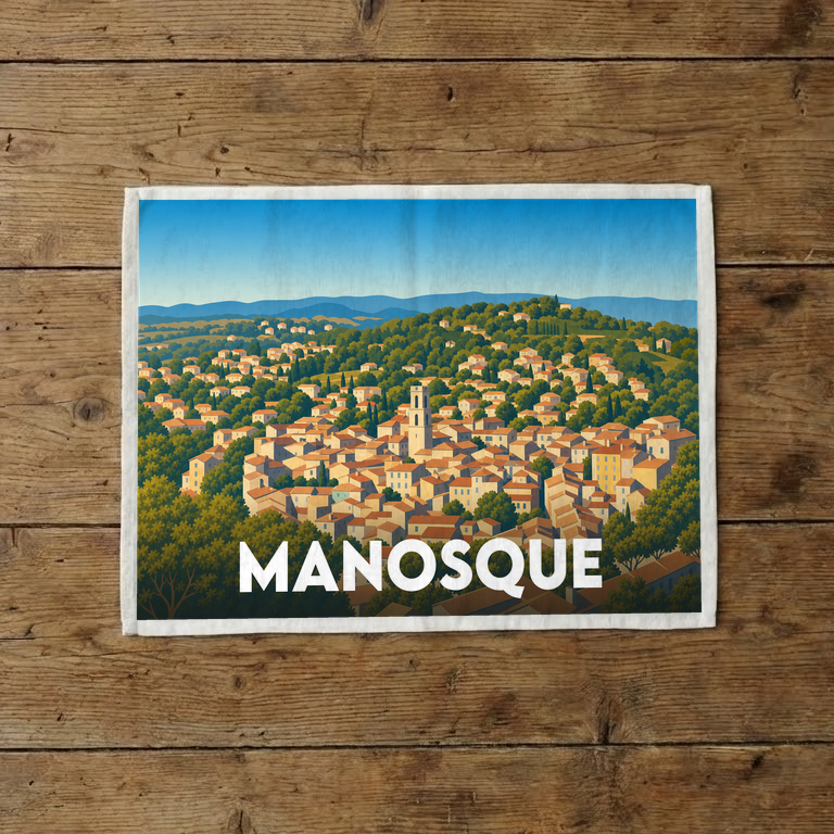 Torchon souvenir de la ville de Manosque avec une illustration stylisée de ses paysages provençaux.