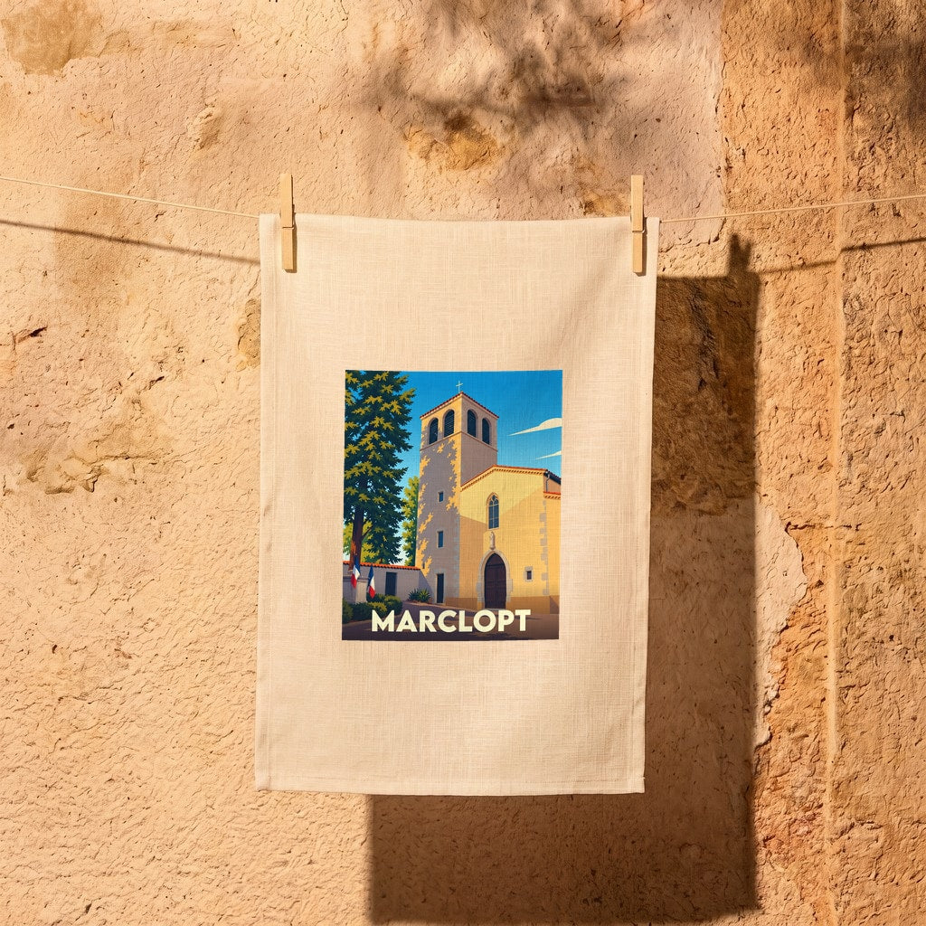 Torchon souvenir de la ville de Marclopt illustré d'une église sous un ciel bleu.