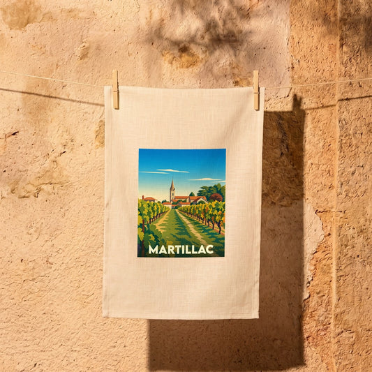 Torchon souvenir de la ville de Martillac avec une illustration stylisée d'un vignoble et de son église.