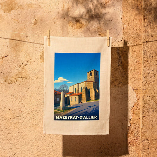 Torchon souvenir de la ville de Mazeyrat-d'Allier avec une illustration stylisée d'une église sous un ciel bleu.