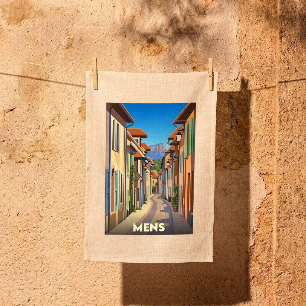Torchon souvenir de la ville de Mens avec une illustration stylisée d'une rue pittoresque.