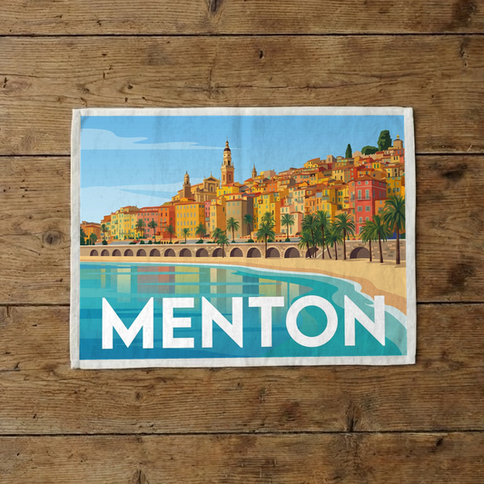 Torchon souvenir de la ville de Menton avec une illustration stylisée de son front de mer coloré.