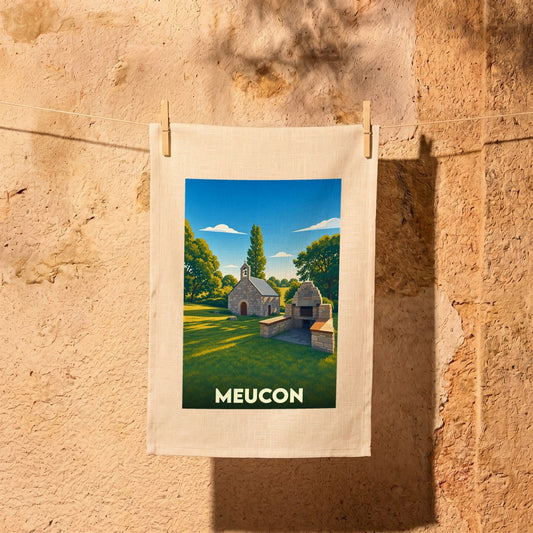 Torchon souvenir de la ville de Meucon avec une illustration stylisée d'une petite chapelle et d'un four à pain.