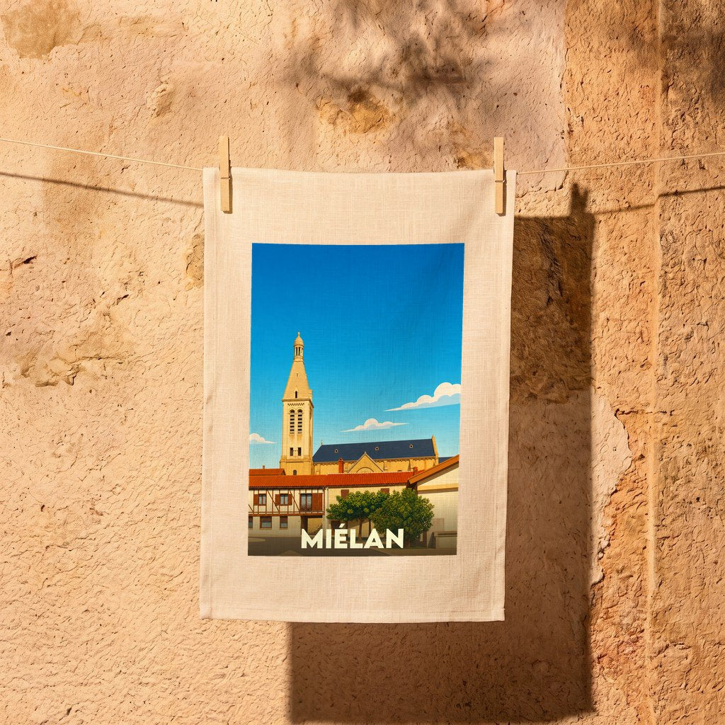 Torchon souvenir de la ville de Miélan avec une illustration stylisée de son église et de ses maisons.