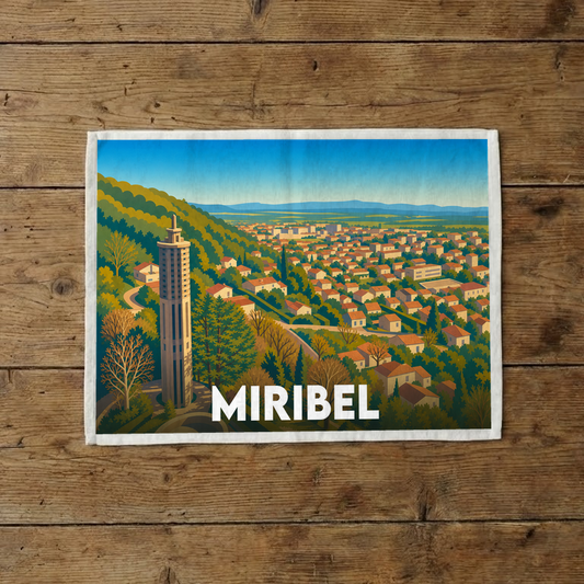 Torchon souvenir de la ville de Miribel orné d'une illustration stylisée représentant sa tour emblématique et son panorama.