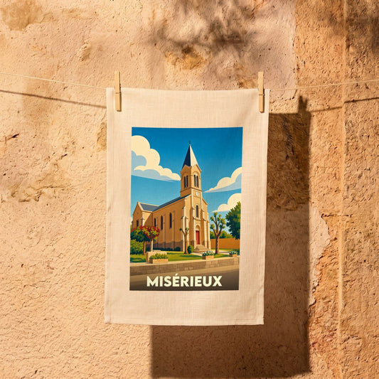 Torchon souvenir de la ville de Misérieux illustré d'une église sous un ciel bleu.