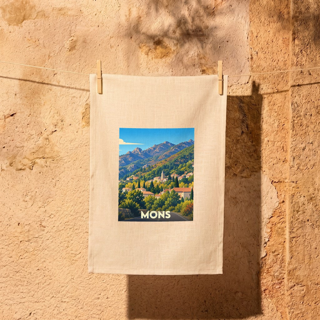 Torchon de cuisine souvenir de la ville de Mons présentant une illustration de paysage montagneux.