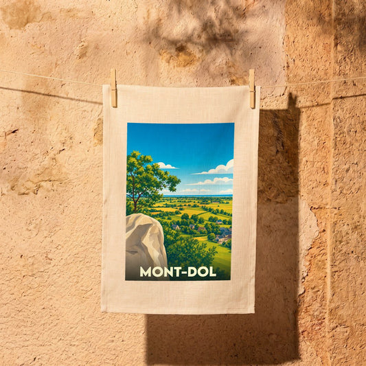 Torchon souvenir de la ville de Mont-Dol illustré d'un paysage panoramique stylisé.