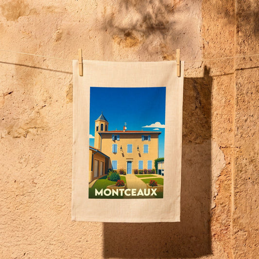 Torchon souvenir de la ville de Montceaux avec une illustration stylisée d'une bâtisse provençale.