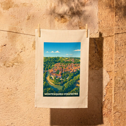 Torchon souvenir de la ville de Montesquieu-Volvestre avec une illustration stylisée.