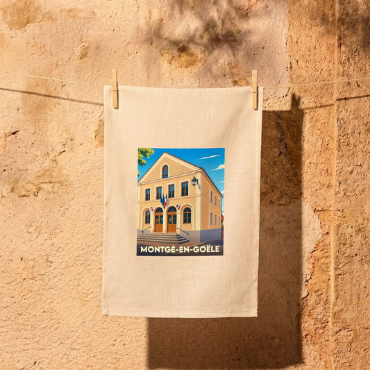 Torchon souvenir de la ville de Montgé-en-Goële avec une illustration stylisée.
