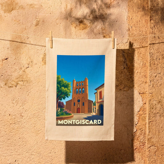 Torchon souvenir de la ville de Montgiscard avec une illustration stylisée de son église typique.