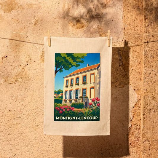Torchon souvenir de la ville de Montigny-Lencoup avec une illustration stylisée d'une maison fleurie.