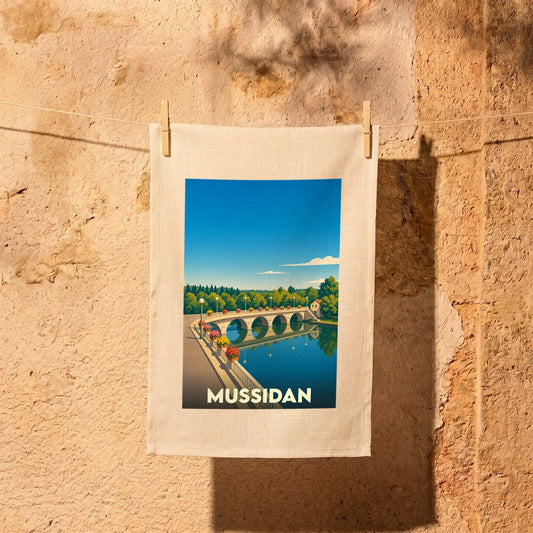 Torchon souvenir de la ville de Mussidan avec une illustration stylisée d'un pont à arcades.