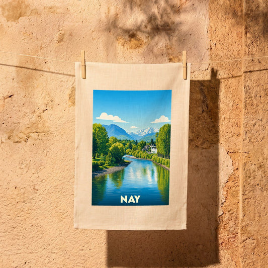 Torchon souvenir de la ville de Nay avec une illustration stylisée d'un paysage montagneux et d'une rivière.