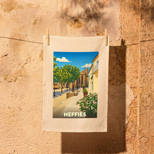 Torchon souvenir de la ville de Neffiès avec une illustration stylisée.