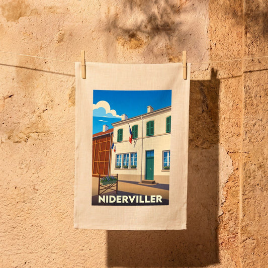Torchon souvenir de la ville de Niderviller avec une illustration stylisée d'un bâtiment typique.