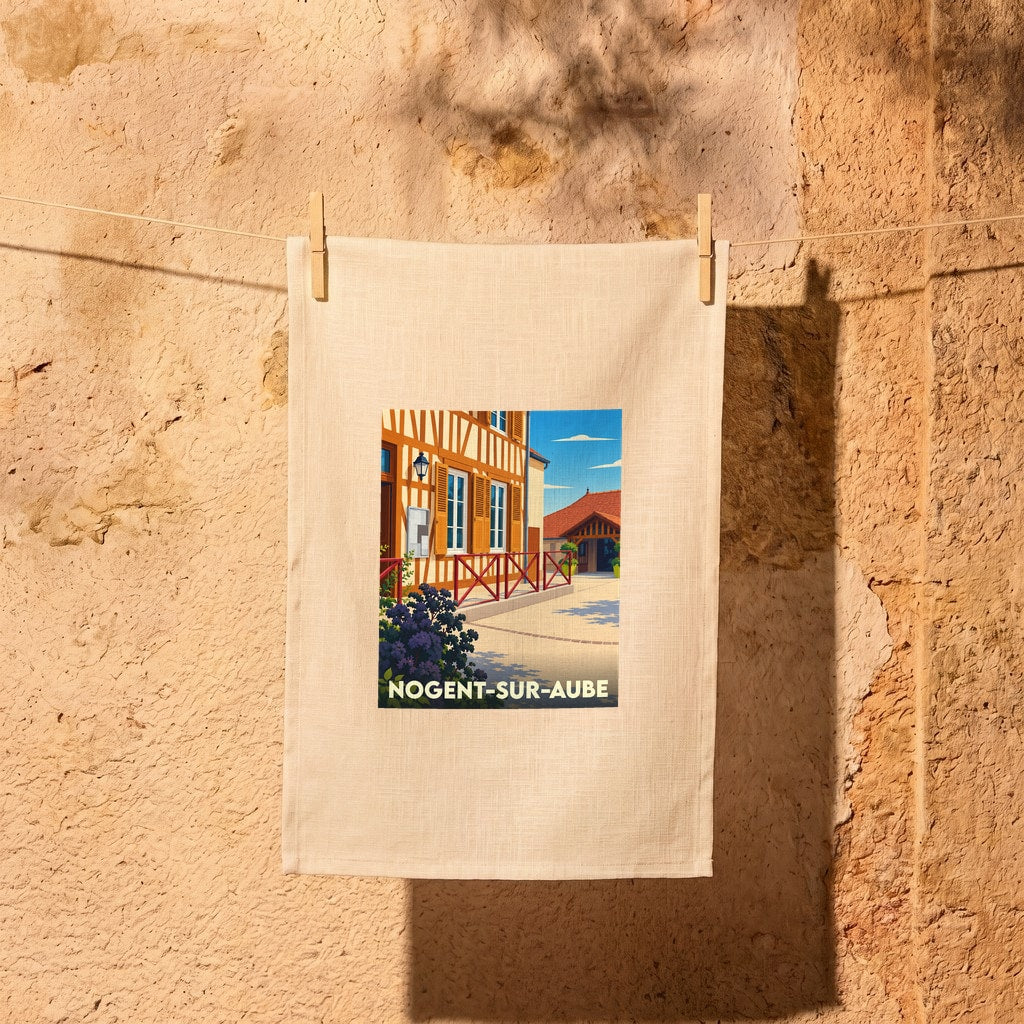 Torchon souvenir de la ville de Nogent-sur-Aube avec une illustration stylisée.