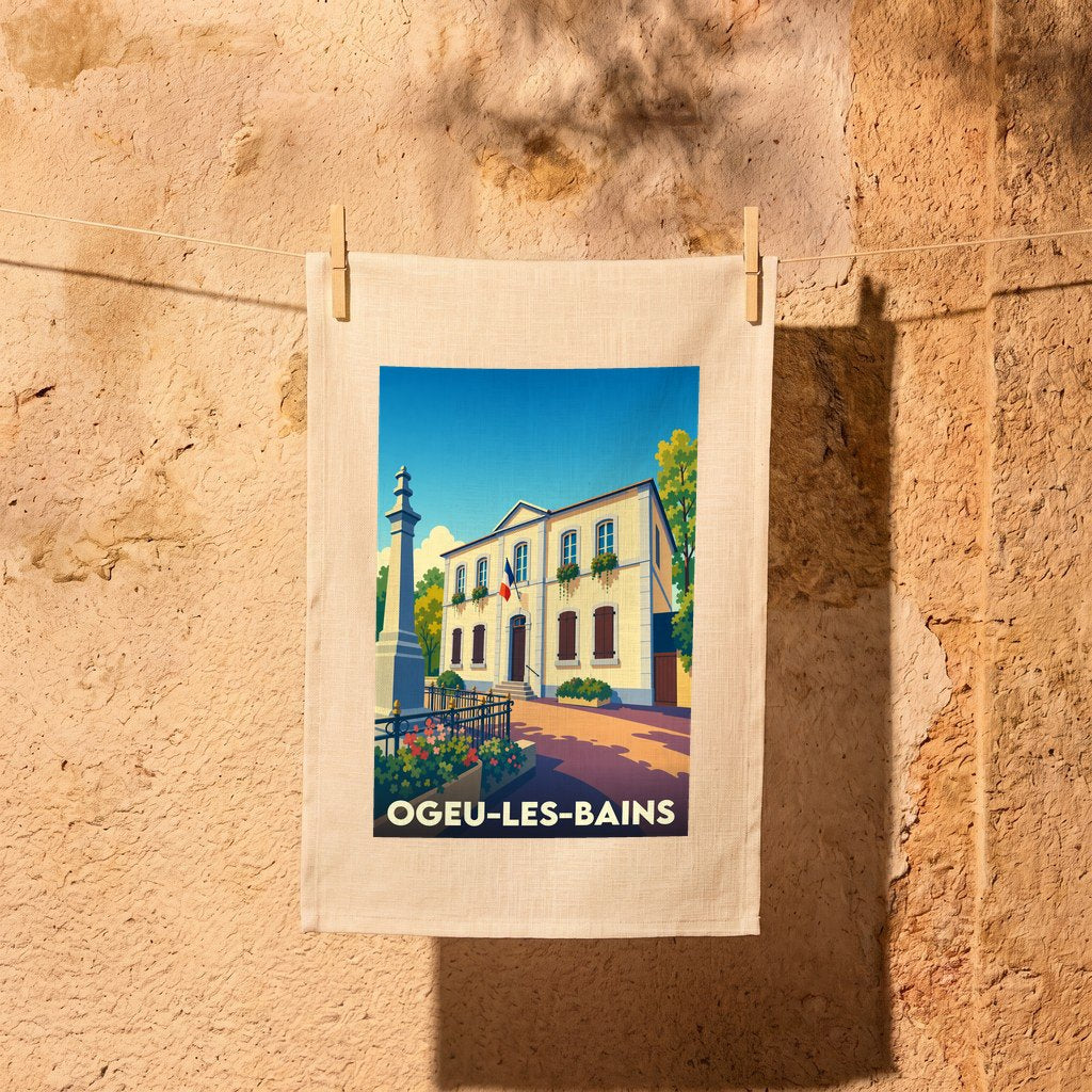 Torchon souvenir de la ville d'Ogeu-les-Bains avec une illustration stylisée de sa mairie.