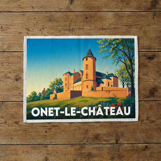 Torchon souvenir de la ville d'Onet-le-Château avec une illustration stylisée de son château médiéval.
