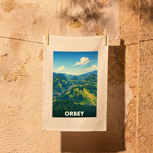 Torchon souvenir de la ville d'Orbey avec une illustration stylisée de ses paysages montagneux.