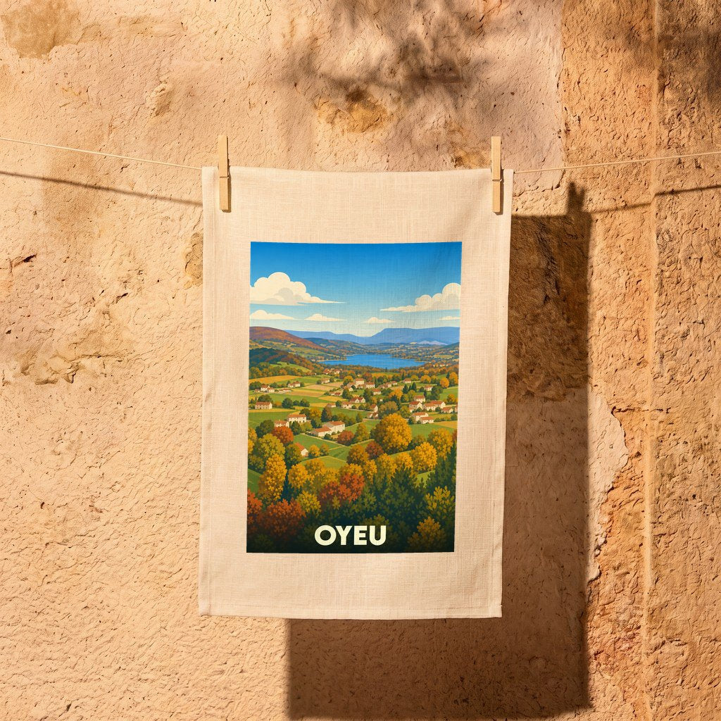 Torchon souvenir de la ville d'Oyeu avec une illustration stylisée d'un paysage de campagne vallonné.