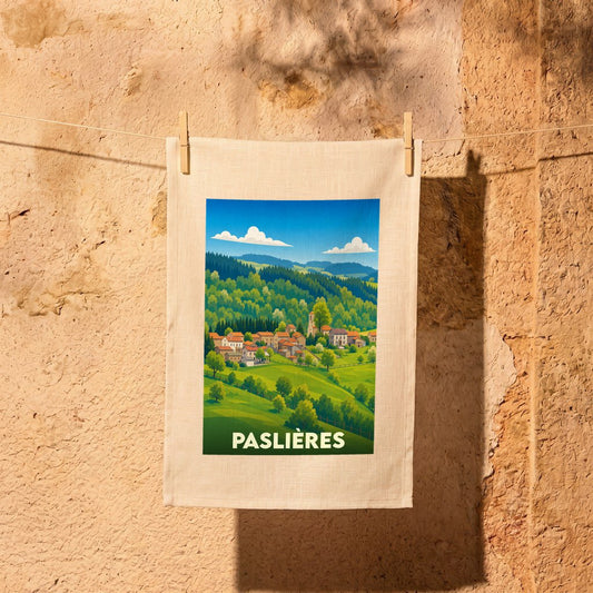 Torchon souvenir de la ville de Paslières avec une illustration stylisée de son paysage vallonné.