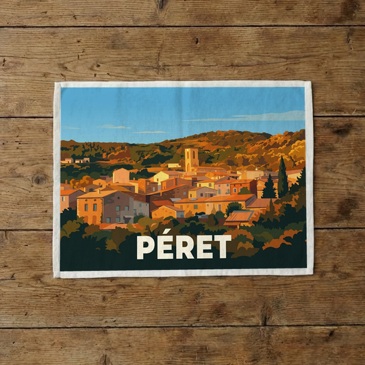 Torchon souvenir de la ville de Péret avec une illustration stylisée du village.