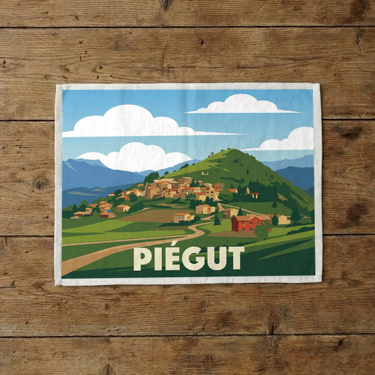 Torchon souvenir de la ville de Piégut avec une illustration stylisée.