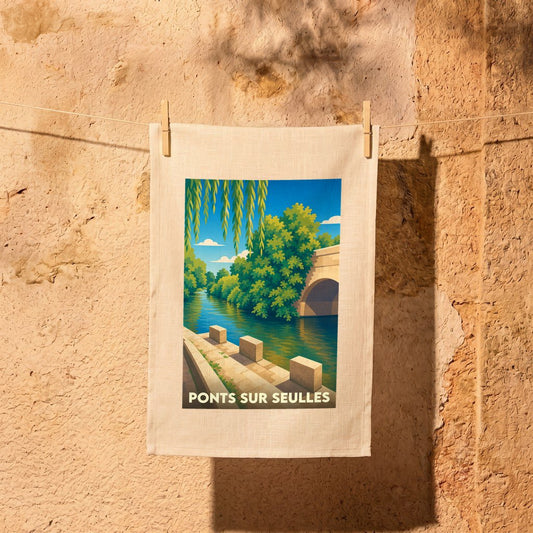 Torchon souvenir de la ville de Ponts-sur-Seulles avec une illustration stylisée d'un pont et d'une rivière.