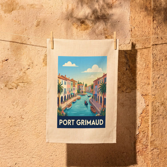 Torchon souvenir de la ville de Port Grimaud avec une illustration stylisée de ses canaux et maisons colorées.
